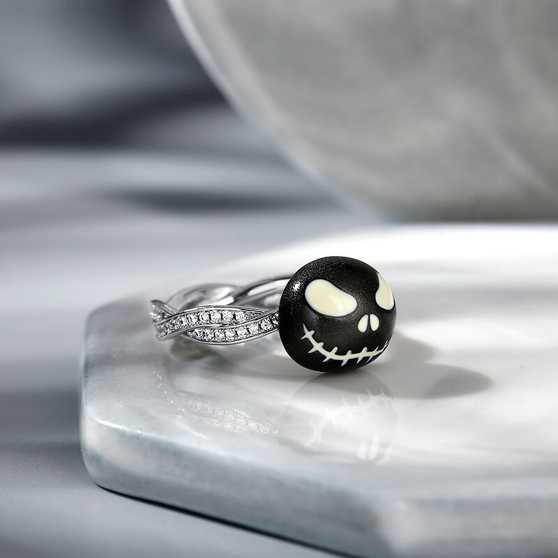 Jeulia Anillo luminoso giratorio con diseño de calavera negra de plata de ley