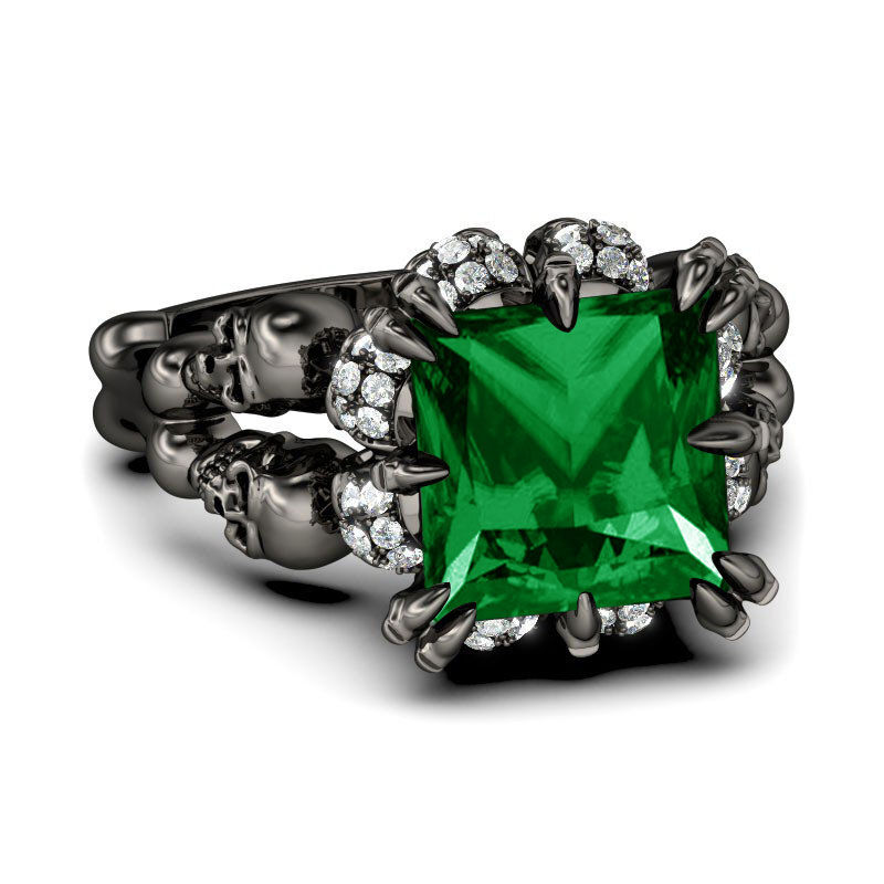 Jeulia Black Tone Princess Cut Created Emerald Four Skull Ring