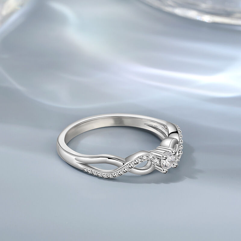 Jeulia Anillo Solitario Redondo Infinito con Diseño Trenzado en Plata de Ley