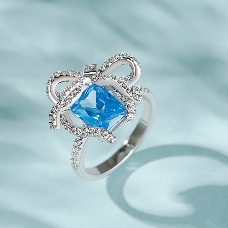 Jeulia "Blue Treasure" Butterfly Knot Radiant Cut Sterling Silver Ring