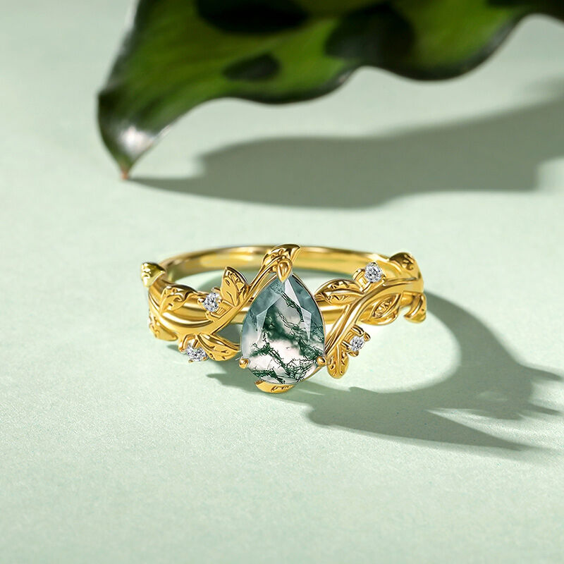 Jeulia Anillo de Compromiso Cruzado Dorado Corte Pera de Ágata Musgo con Hoja de Vid