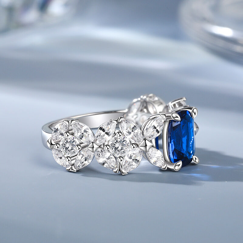 Jeulia Anillo de plata de ley con diseño de flor de cuatro pétalos y forma oblonga